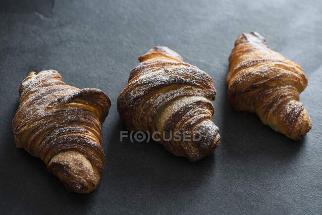 Close-up shot of Homemade croissants on grey — Stock Photo