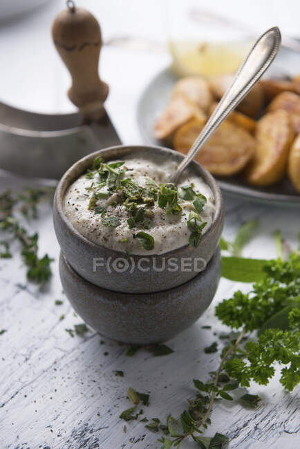 Vegan cashew and herb dip with mini roasted potatoes — Stock Photo