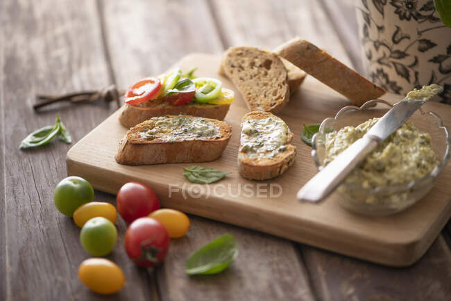 Bread with basil butter — Stock Photo