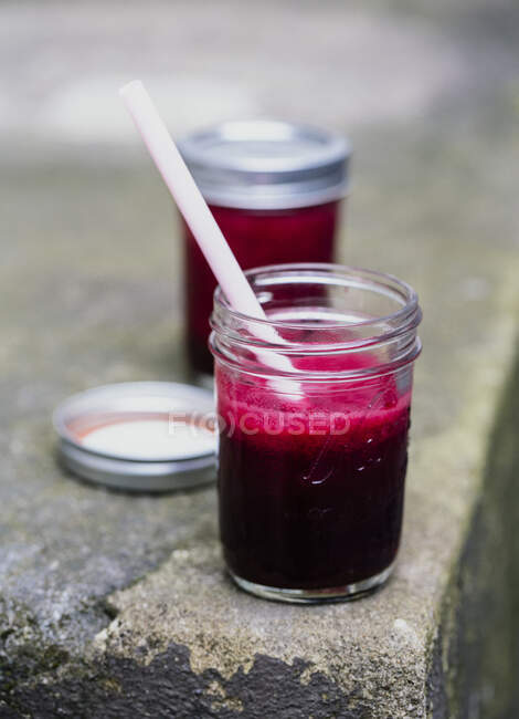 Beetroot juice in a jar with a straw — Stock Photo