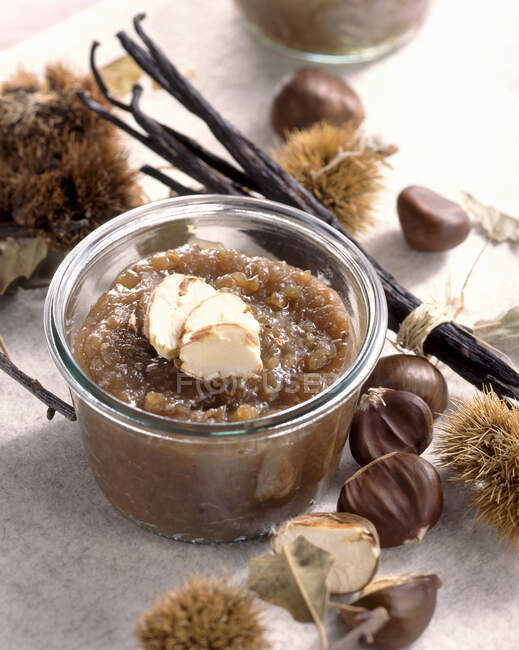 A jar of chestnut preserve with vanilla and chestnuts — Stock Photo