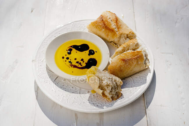 Olive oil, Aceto Balsamico and fresh baguette — Stock Photo