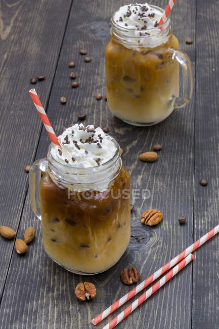 Cold coffee with whipped cream — Stock Photo
