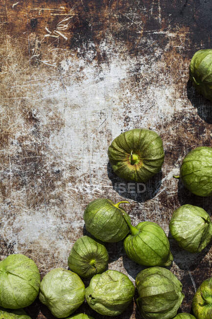 Tomatillos on a rusty surface — Stock Photo