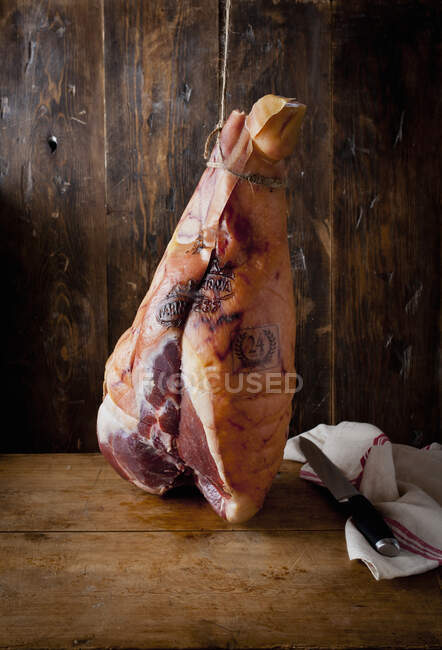 Prosciutto on table close-up view — Stock Photo
