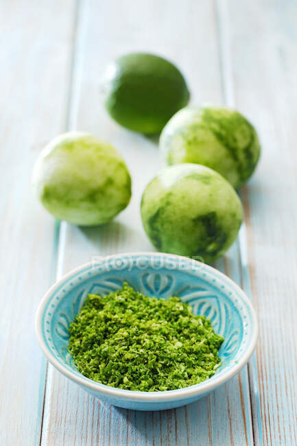 Lime zest in a small bowl — Stock Photo