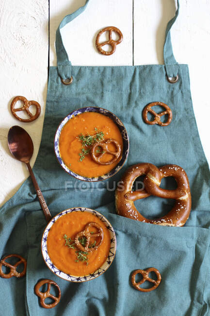 Pumpkin soup with salted pretzels — Stock Photo