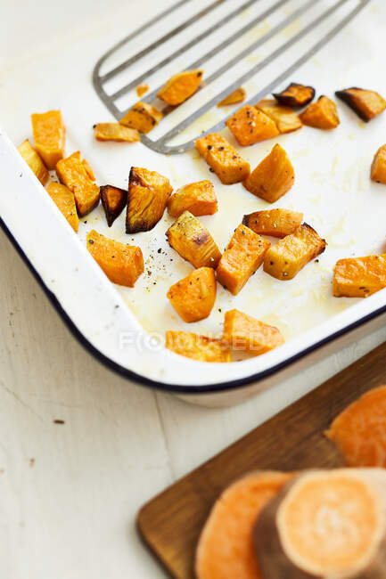 Roasted sweet potato pieces — Stock Photo