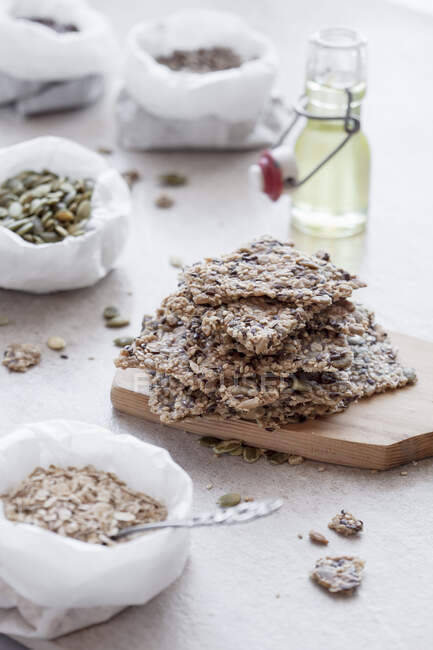 Crispy seeds crackers with seeds in sacks — Stock Photo
