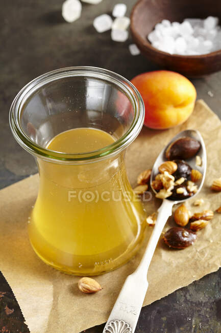 Homemade apricot liqueur with rock sugar and corn schnapps — Stock Photo