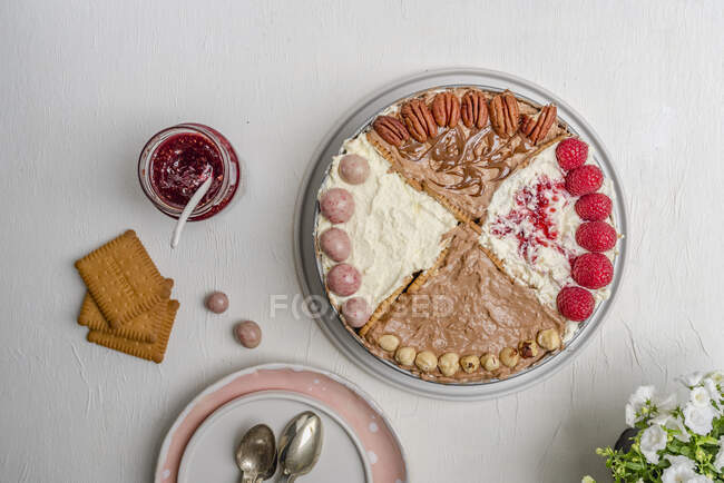 Four different quarters of cake put together as one — Stock Photo