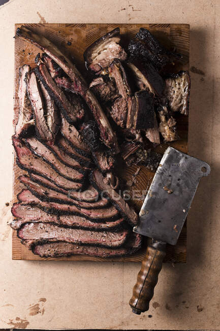 Beef brisket and ribs with old cleaver — Stock Photo