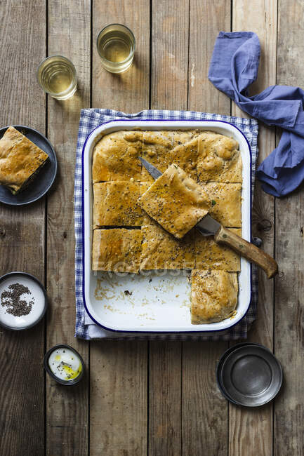 Borek cake with beetroot leaves and feta cheese, black sesame seeds — Stock Photo