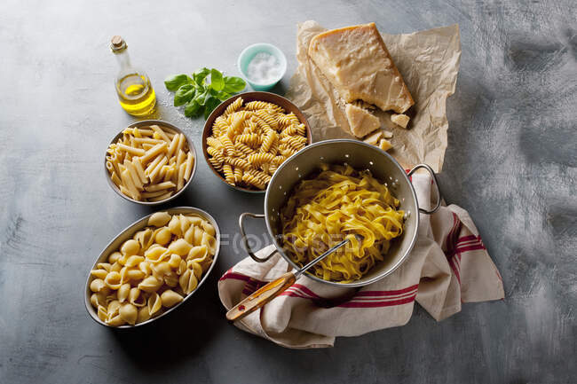 Pasta selection on grey background — Stock Photo