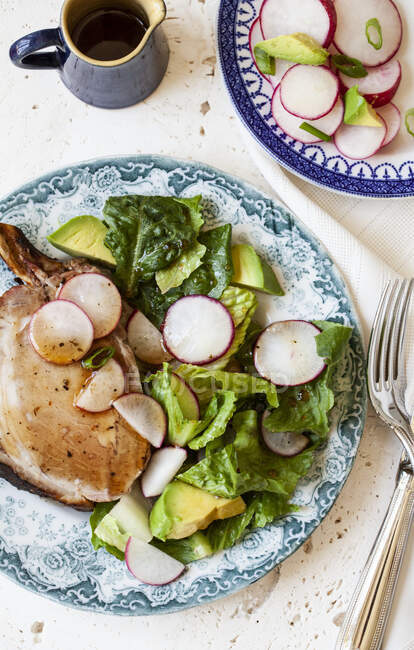 Barbequed pork chop, topped with honey and balsamic glaze with salad — Stock Photo