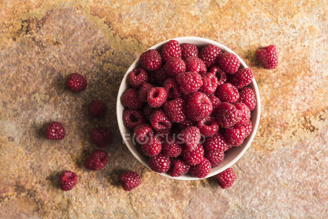 Top view of Fresh Raspberries in white bowl — Stock Photo