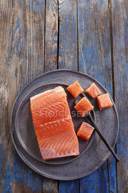 Pieces of raw salmon, top view — Photo de stock