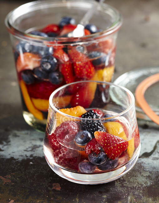 Homemade rum punch with berries and apricots — Stock Photo