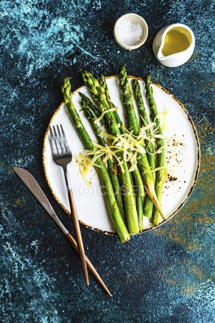 Organic grilled asparagus served for healthy keto lunch on stone background with copy space — Stock Photo