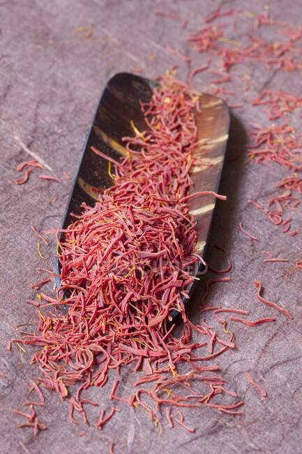 Saffron threads in a wooden bowl — Stock Photo