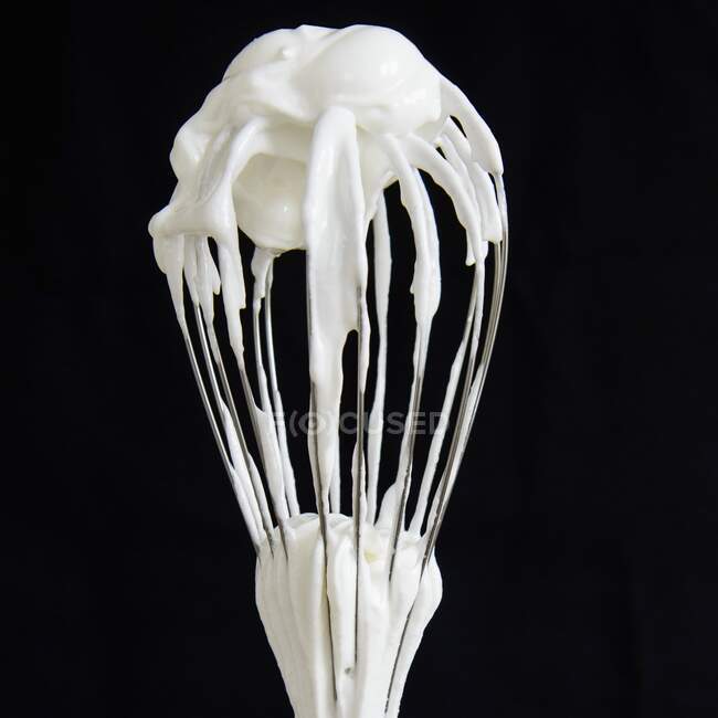 Eggwhites on whisk close-up view — Stock Photo