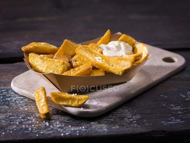 Homemade french fries with salt and mayonnaise — Stock Photo
