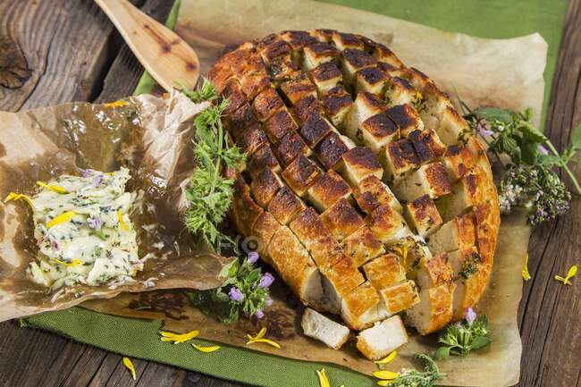 Pull apart bread with herb butter — Stock Photo
