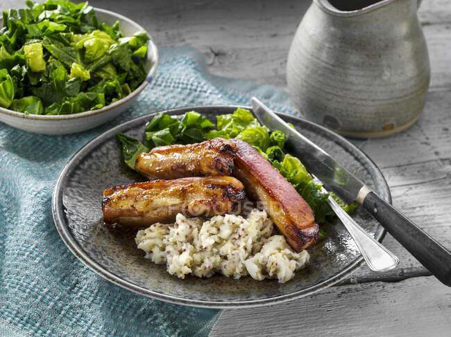 Pork belly mash with salad — Stock Photo