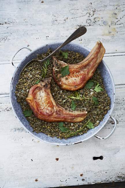 Pork chops with puy lentils — Stock Photo