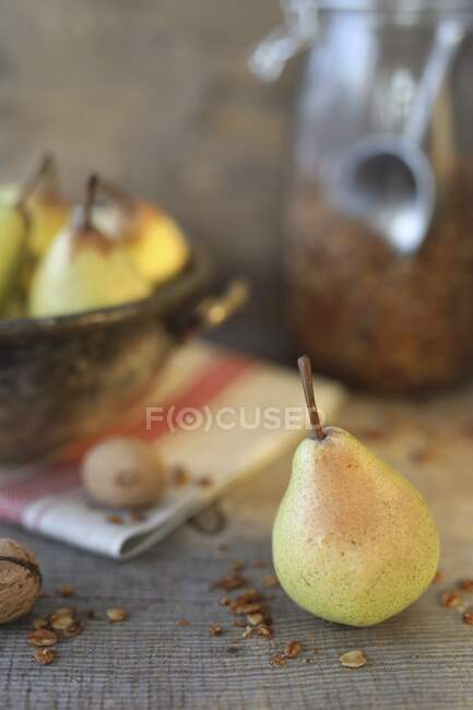 Pears with granola close-up view — Stock Photo