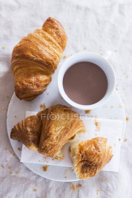 Croissants and coffee close-up view — Stock Photo