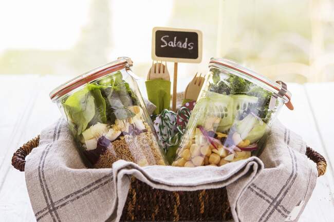 Two salads in jars into a bascket prepared in a buffet service for a brunch — Stock Photo