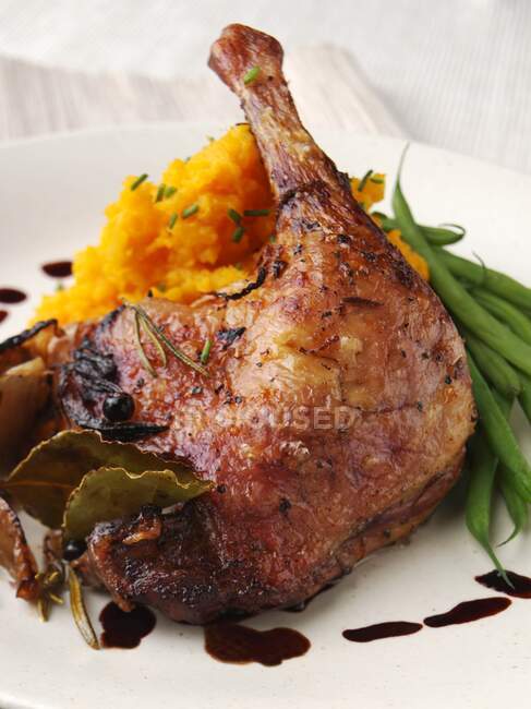 A roast duck leg with mashed swede — Stock Photo
