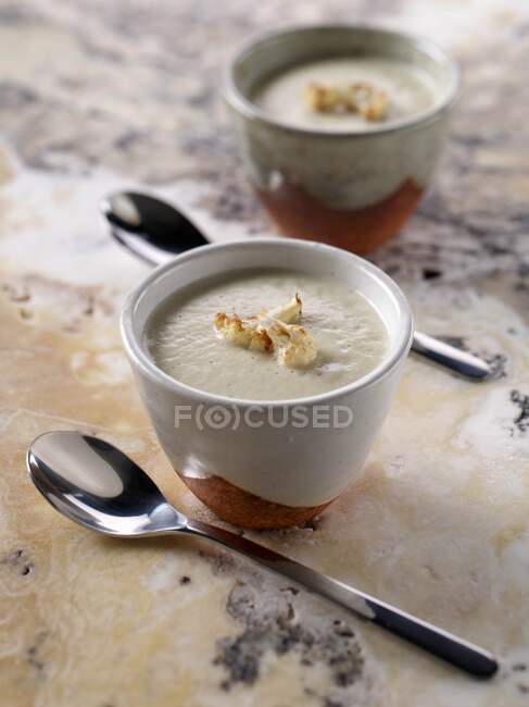 Bowls of cauliflower soup — Stock Photo