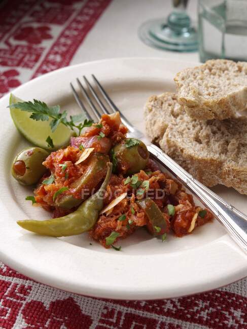 Salt cod bacalao portion in a mexican setting — Stock Photo