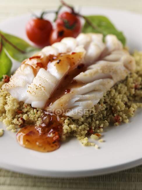 Steamed cod with sweet chili sauce and couscous — Stock Photo
