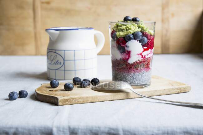 Chia pudding with avocado and berries — Stock Photo