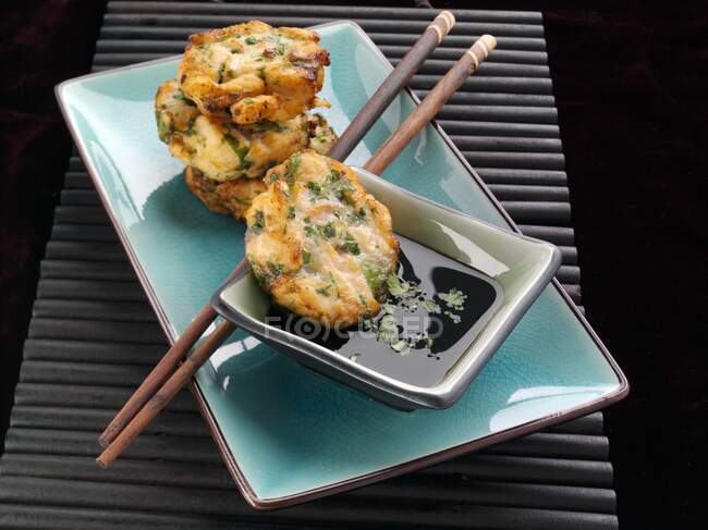 Salmon cakes with soy sauce — Stock Photo