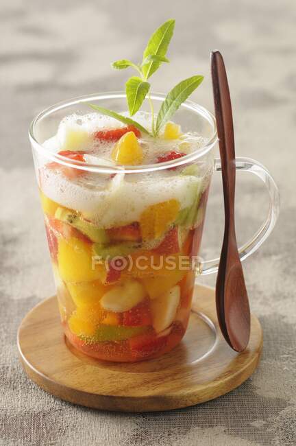Fruit soup with apple foam — Stock Photo