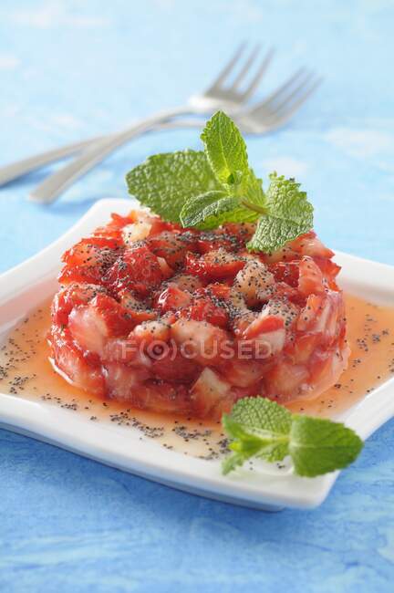Strawberry tartare with poppy seeds and mint — Stock Photo