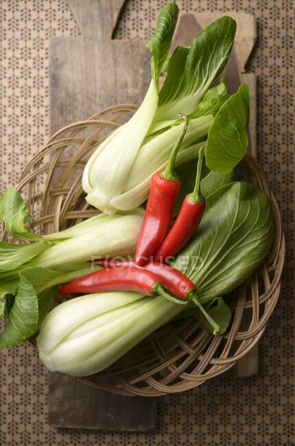 Fresh bok choy and chilli peppers from Indonesia — Stock Photo