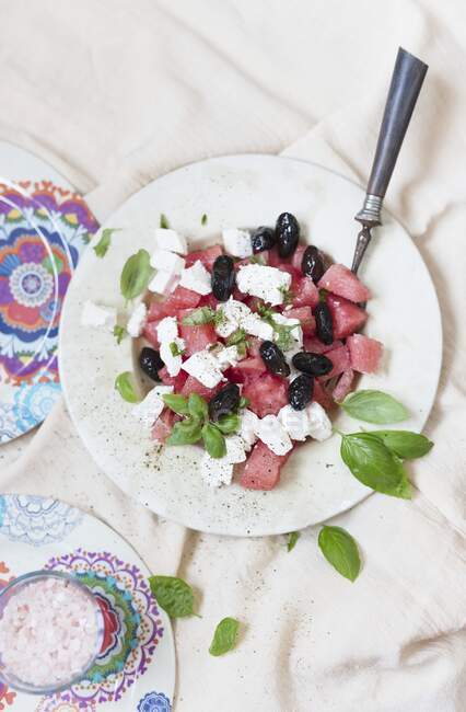 Watermelon salad with feta and olives — Stock Photo