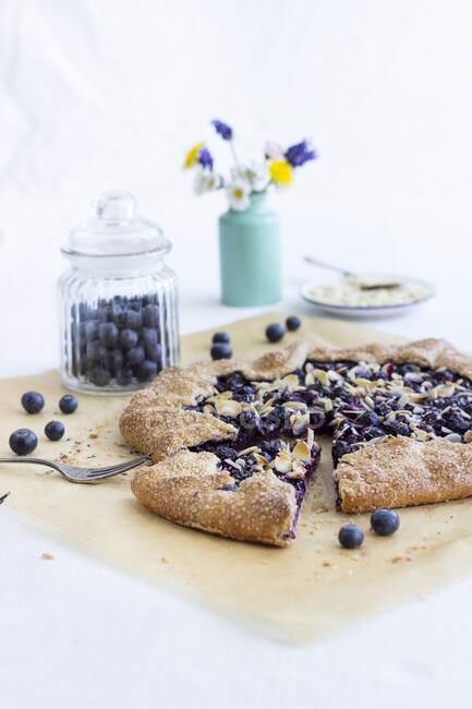 Summery shortbread galette with blueberry lemon filling and almonds — Stock Photo