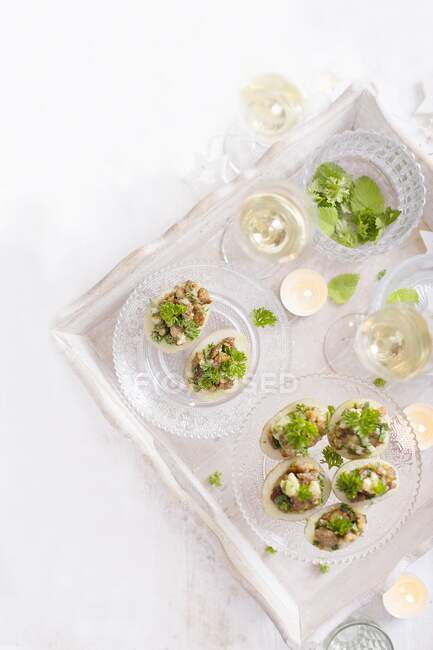 Bacon Stuffed Potatoes with Parsley on a serving board — Stock Photo