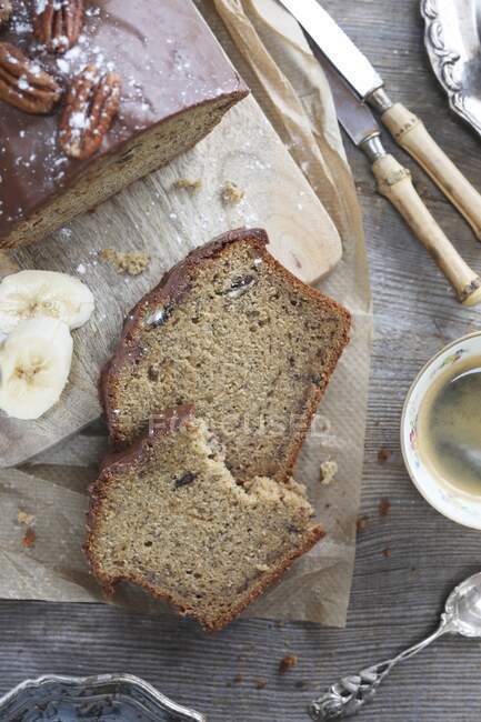 Vintage style banana bread with pecan and chocolate on top — Stock Photo