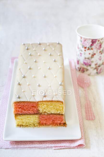 Battenberg cake with marzipan and edible silver beads — Stock Photo