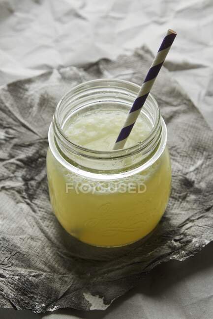 Ginger beer in a glass jar with a straw — Stock Photo