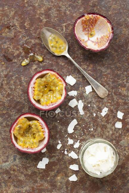 Passionfruit and coconut flakes close-up view — Stock Photo