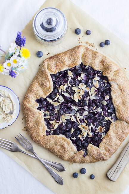 Summery shortbread galette with blueberry lemon filling and almonds — Stock Photo