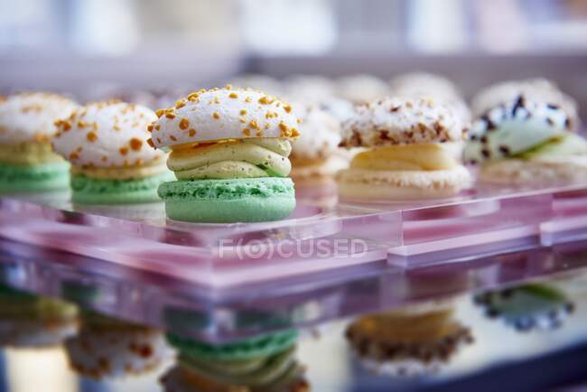 Various macarons on glass tray, close up shot — Stock Photo
